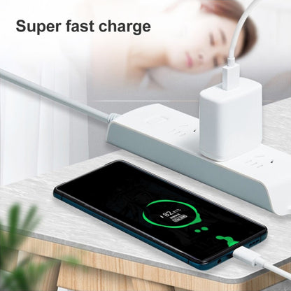 USB-A to USB-C cable connected to a smartphone on a charging station