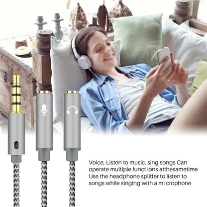 Braided 3.5mm audio splitter cable with mic and headphone connectors in use