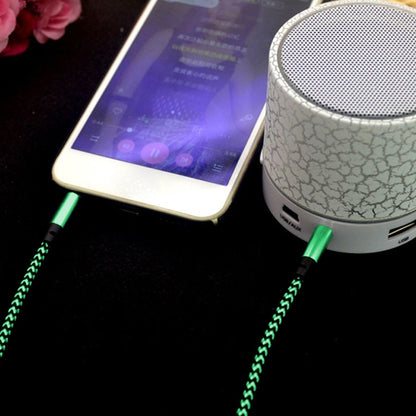 Green nylon braided 3.5mm male audio cable connected with gold-plated plug