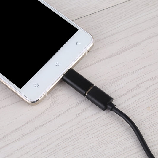 Black USB-C female to micro USB male adapter with short cable and connector