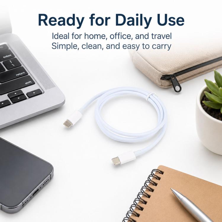 White USB-C to USB-C charging cable, 1 m, neatly coiled for home or travel