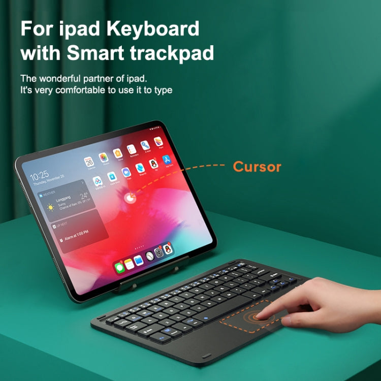 Bluetooth keyboard with touchpad in use with tablet and hand controlling cursor