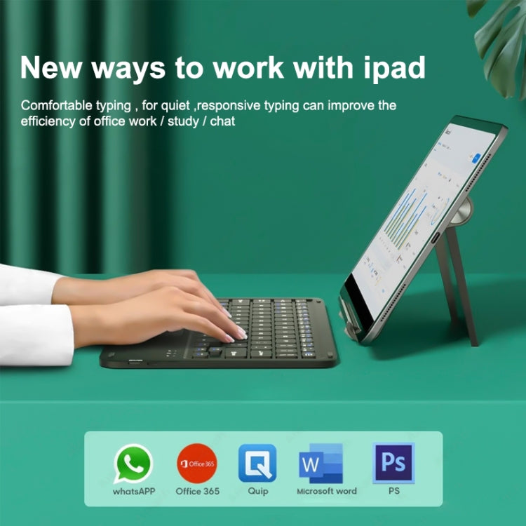Bluetooth keyboard with touchpad in use with tablet, typing with a hand