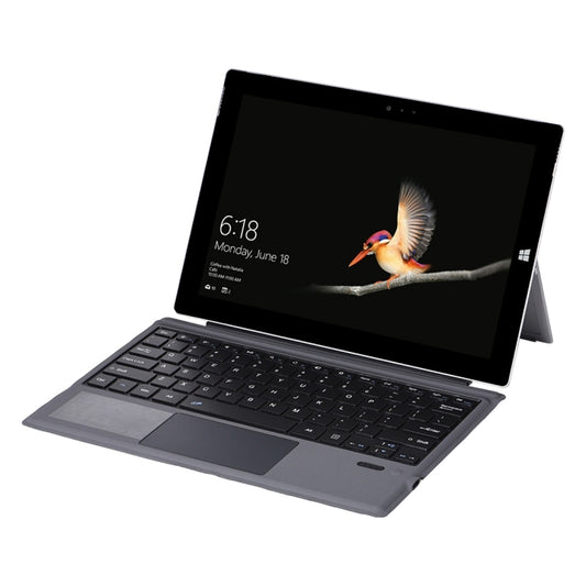 Gray Bluetooth keyboard case with leather-style cover, tablet open at an angle