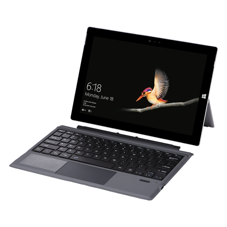 Gray tablet keyboard case with Bluetooth keyboard, tablet propped up
