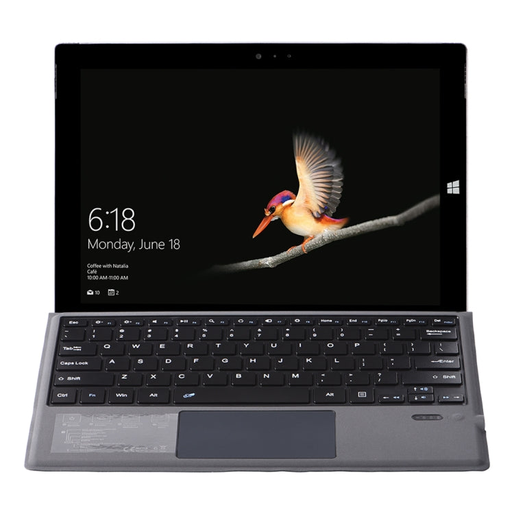 Gray tablet keyboard case, close-up of QWERTY keys and touchpad
