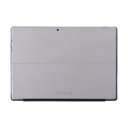 Gray flip tablet case back with camera hole opening and smooth leather texture
