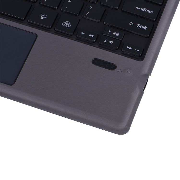 Corner view of dark gray keyboard holster with power button and ports