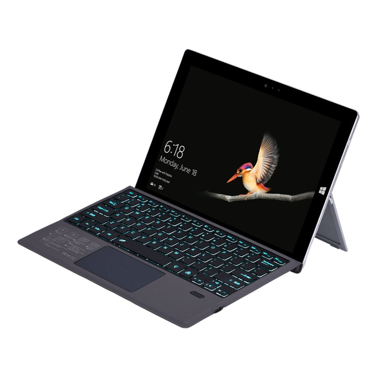 Dark blue Bluetooth keyboard holster case for Microsoft Surface, cyan and green backlit keys