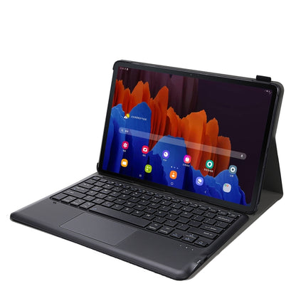 Black leather tablet case with keyboard and touchpad, tablet propped at viewing angle