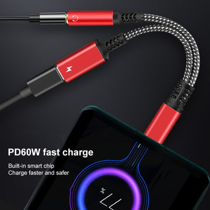 Red USB-C to 3.5mm audio and PD 60W charging adapter with braided cord.