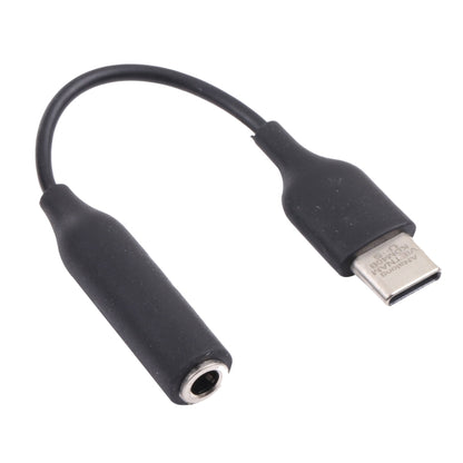 Black USB-C to 3.5mm audio adapter with USB-C plug and 3.5mm jack