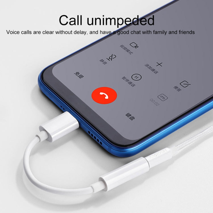 USB-C to 3.5mm audio adapter connected to smartphone