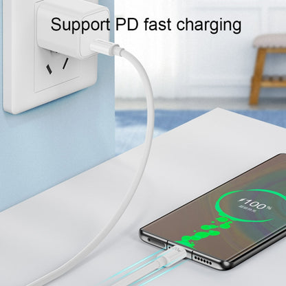 White USB-C to USB-C cable connected to a charger and smartphone