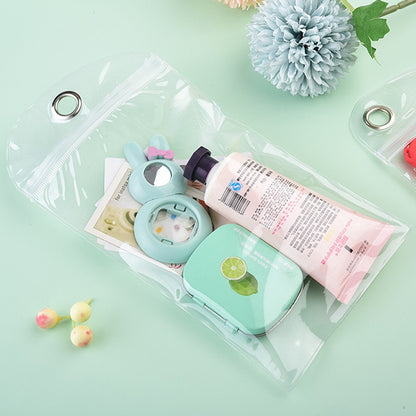 Clear PVC self-sealing zip bag with metal grommet, holding small accessories