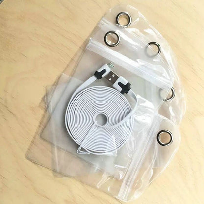 Clear PVC self-sealing zip pouch with metal grommet, holding charging cable