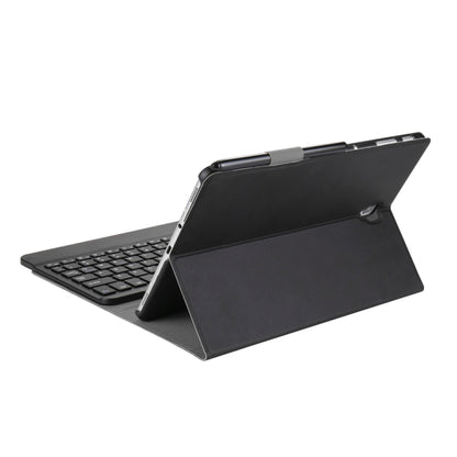 Black tablet folio case with kickstand and detachable Bluetooth keyboard, side view