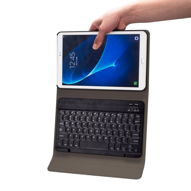 Black keyboard tablet case held in hand with tablet on attached keyboard