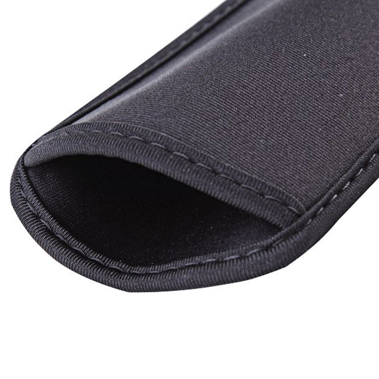 Close-up of black neoprene phone pouch edge stitching and elastic trim