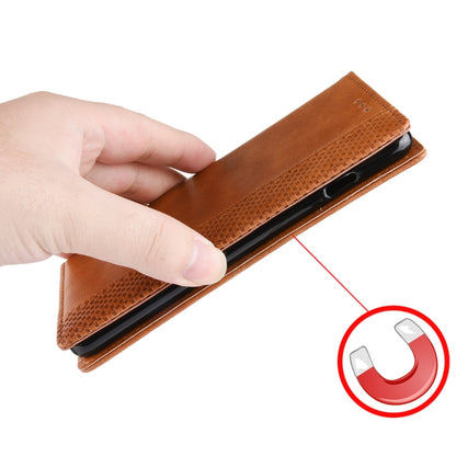 Brown leather flip phone case with magnetic closure, showing front cover texture