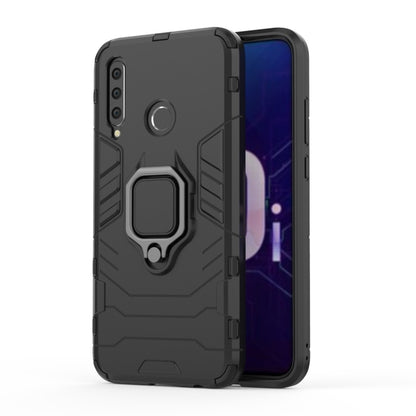 Rugged black phone case with magnetic ring holder, raised edges, and camera cutouts