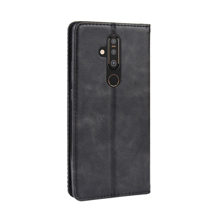 Black horizontal flip leather phone case with camera cutout and magnetic closure