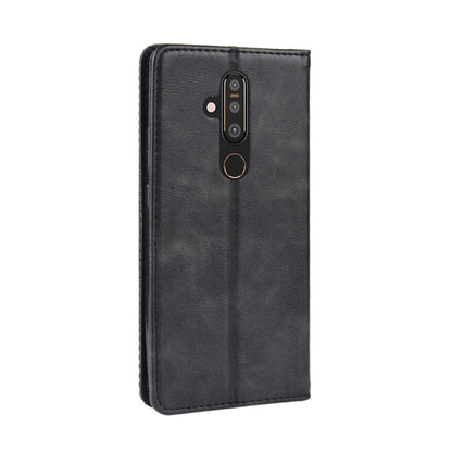 Black horizontal flip leather phone case with camera cutout and magnetic closure