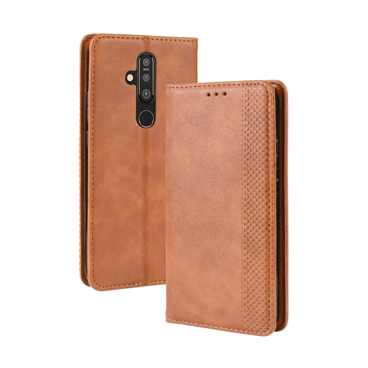 Brown horizontal flip leather phone case with magnetic closure and camera cutout