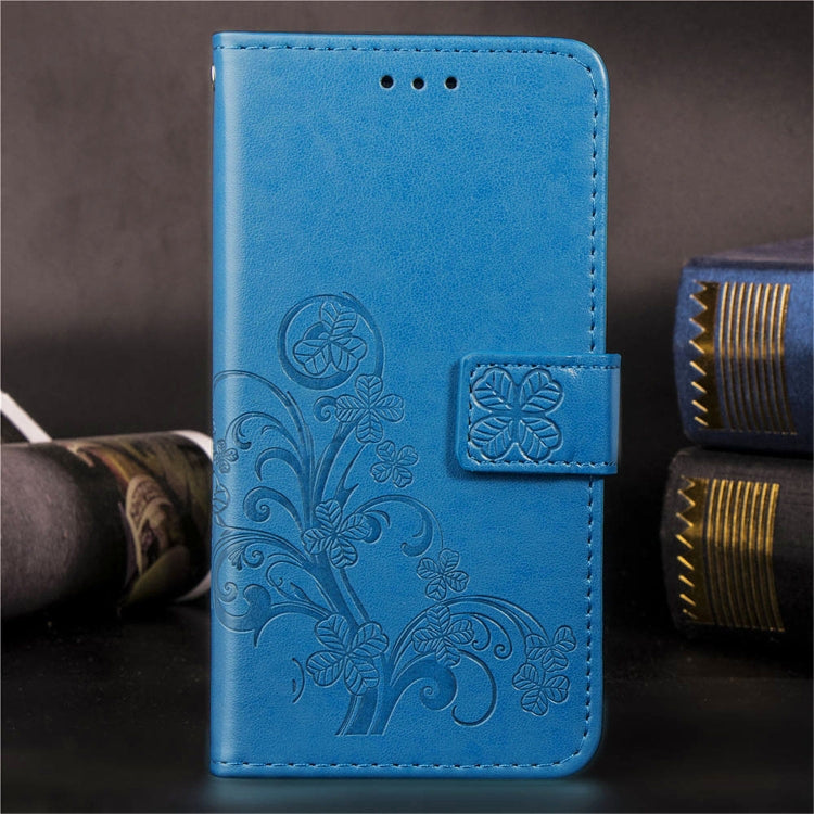 Blue embossed floral phone wallet case with side card holder and stitched edges.