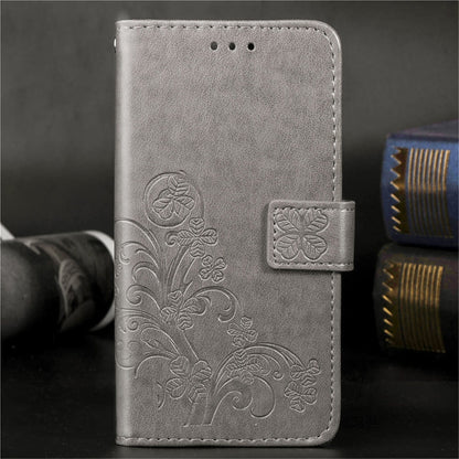 Gray embossed floral phone wallet case with side card holder and stitched border.
