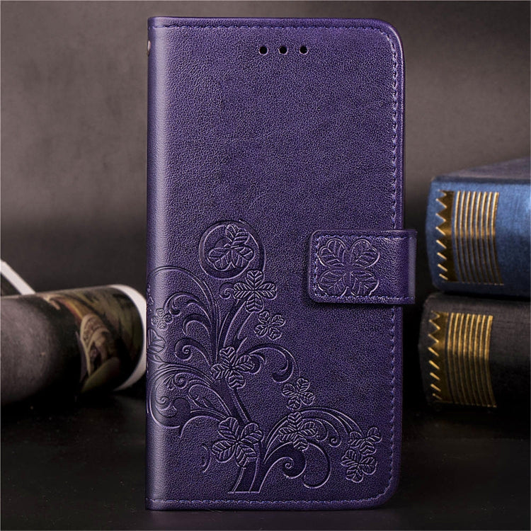 Purple embossed floral phone wallet case with side card holder and stitched edges.