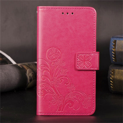 Pink embossed floral phone wallet case with side card holder and snap flap.