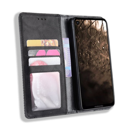 Black leather flip case with card slots and photo window, holding a phone