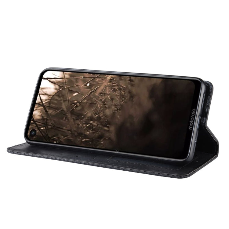 Black leather flip phone case in stand position with camera cutout