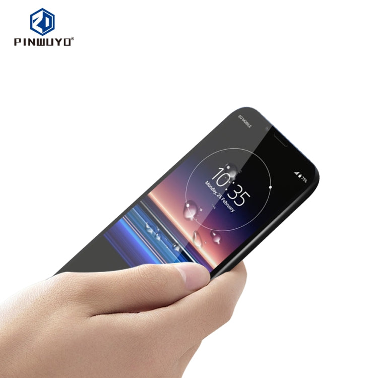 Hand holding black tempered glass film for Sony Xperia 1, full screen fit