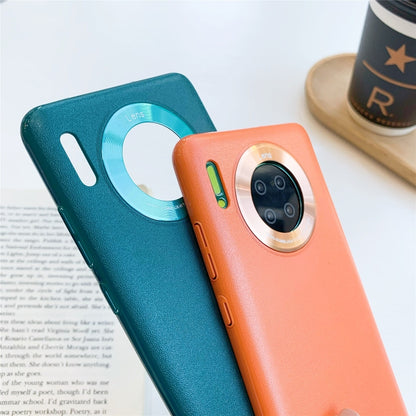 Orange plastic phone case with lens-ring camera protector and side button cutouts
