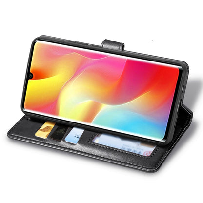 Black flip wallet phone case propping phone up with card slots and camera opening