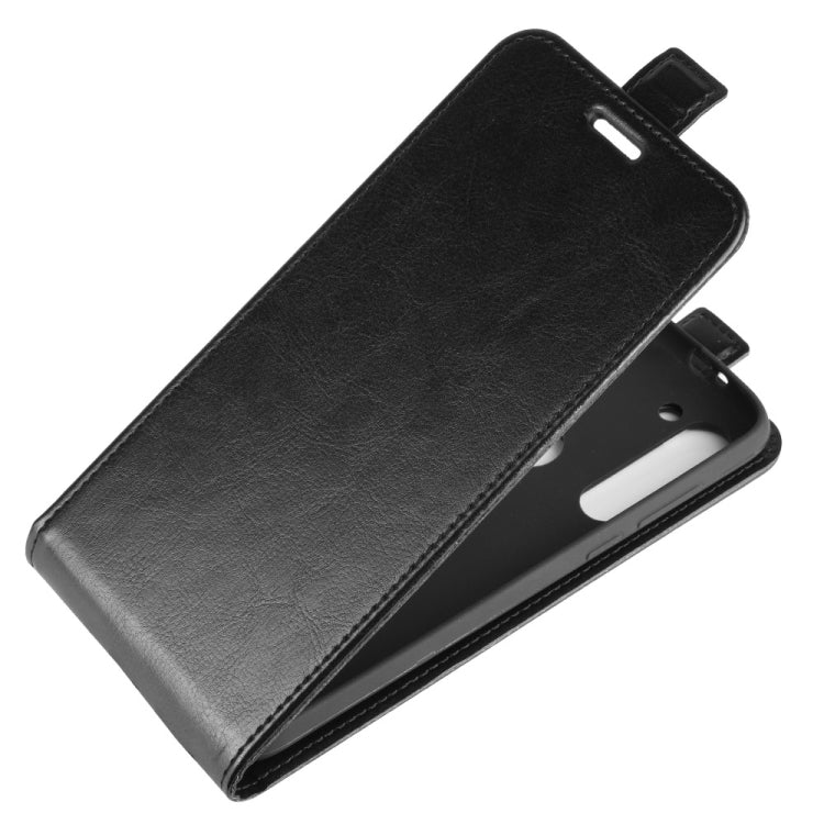 Black leather vertical flip phone case with magnetic-style flap and side cutouts