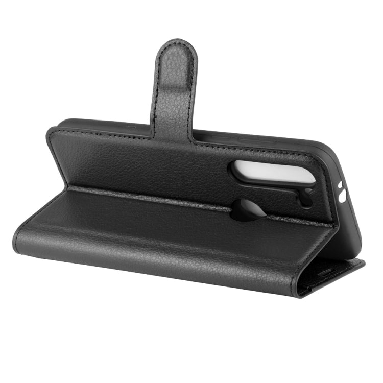 Black folio flip case with hand strap and cutout for camera and speaker