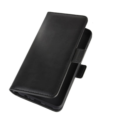 Magnetic flip leather phone case with buckle strap, black, side angle view.
