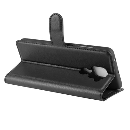 Black flip stand phone case with magnetic-style flap and back camera opening