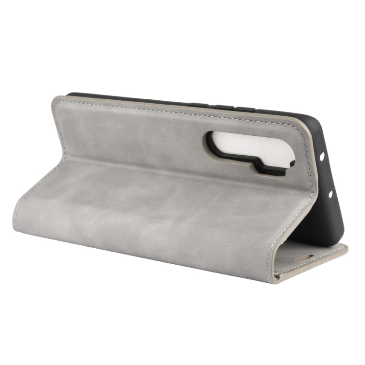 Leather magnetic wallet phone case, grey; stand view with carry strap for Xiaomi Mi Note 10 Lite.