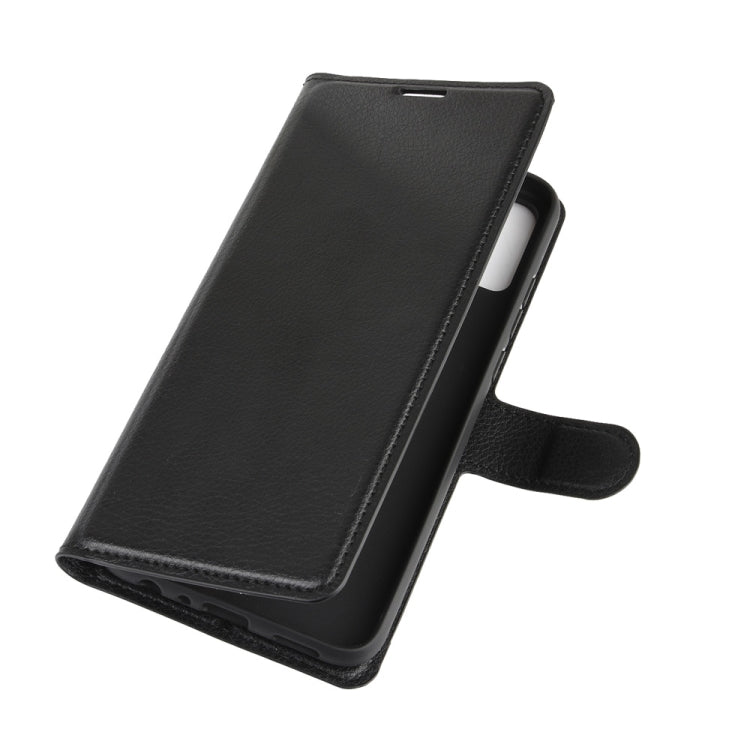 Black flip wallet phone case with smooth fold-over front and hand strap