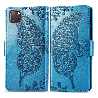 Blue embossed butterfly flip wallet case for Huawei Y5P with strap closure