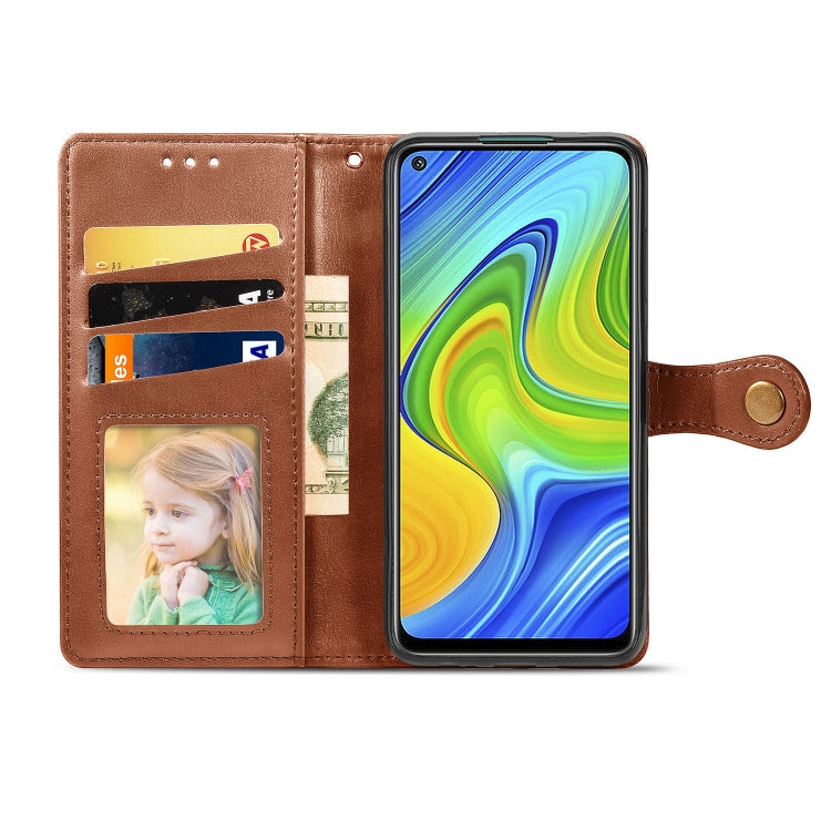 Brown leather-look phone wallet case with photo window and card slots, snap buckle