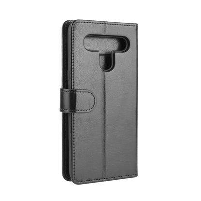 Gray textured flip phone wallet case with strap closure and camera cutout