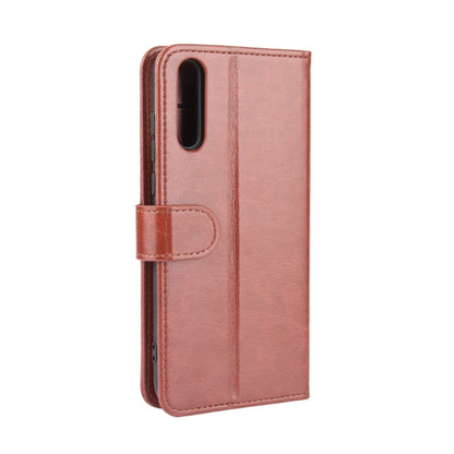 Brown flip phone case with side button cutouts and hinged protective flap