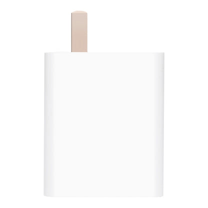 White compact USB charging adapter with exposed plug prongs