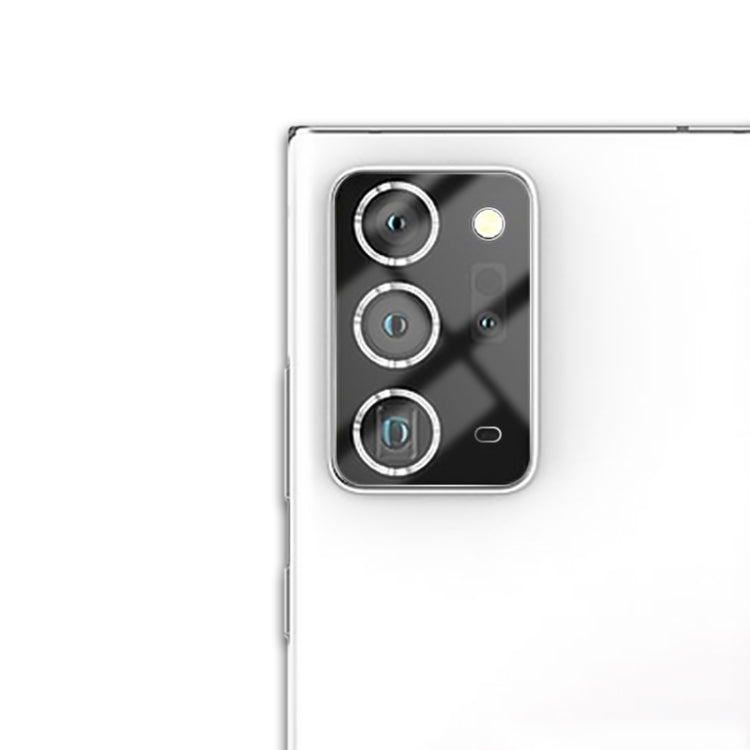 Rear camera lens tempered glass film covering three camera lenses on a silver phone