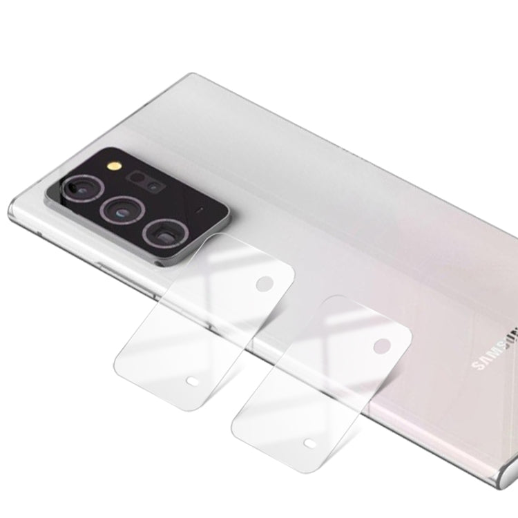 Pack of clear tempered glass lens protectors with triple-lens cutouts for installation
